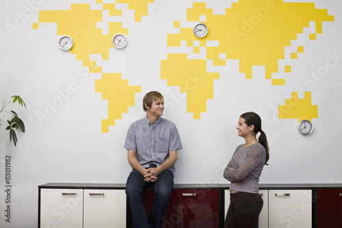 A woman and a man taking a break in an office photo