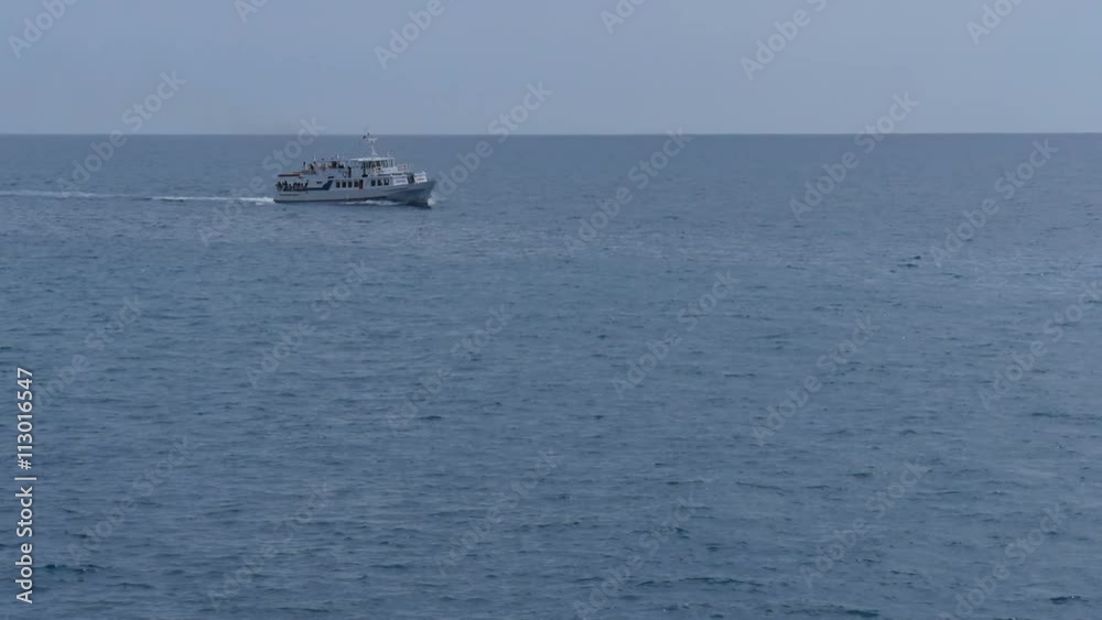 White ship sails on the sea rocking on the waves White ship sails on the sea rocking on the waves