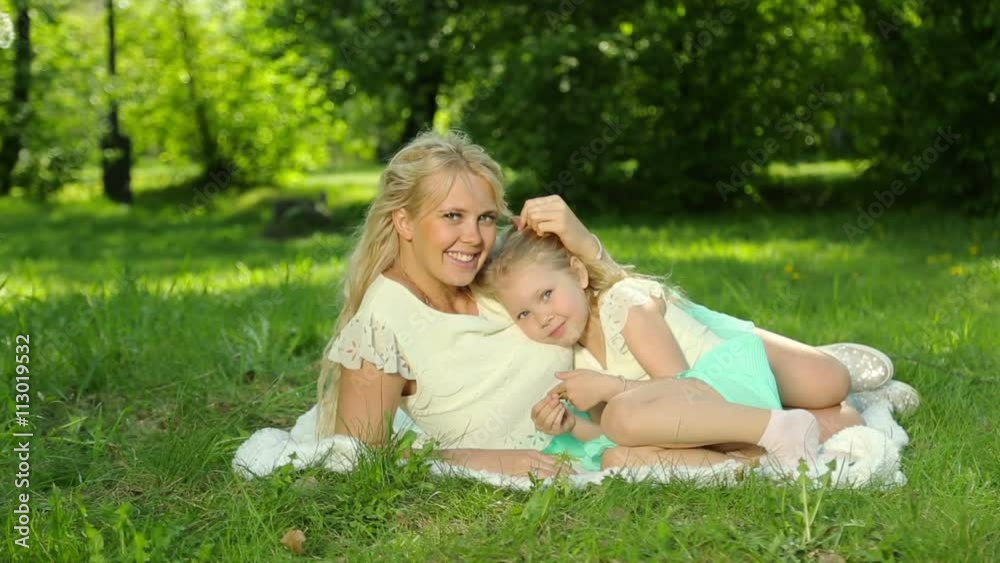Young pregnant mother plays with her daughter. Happy family. Young pregnant mother plays with her daughter. Happy family.