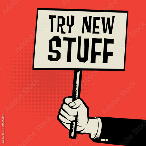 Poster in hand, business concept with text Try New Stuff