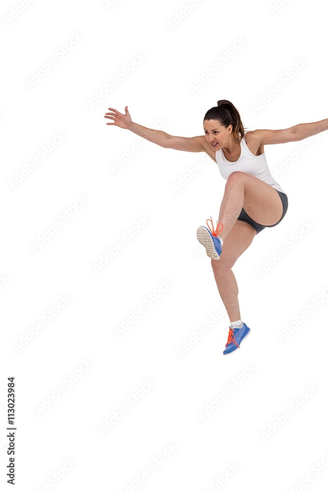 Athletic woman running on white background