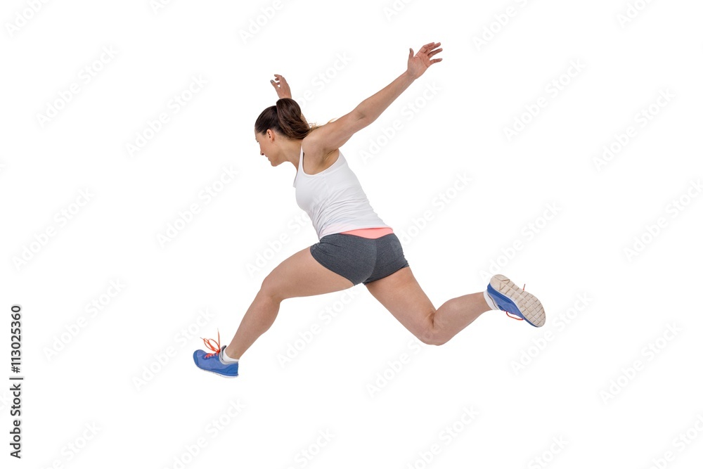 Athletic woman running on white background