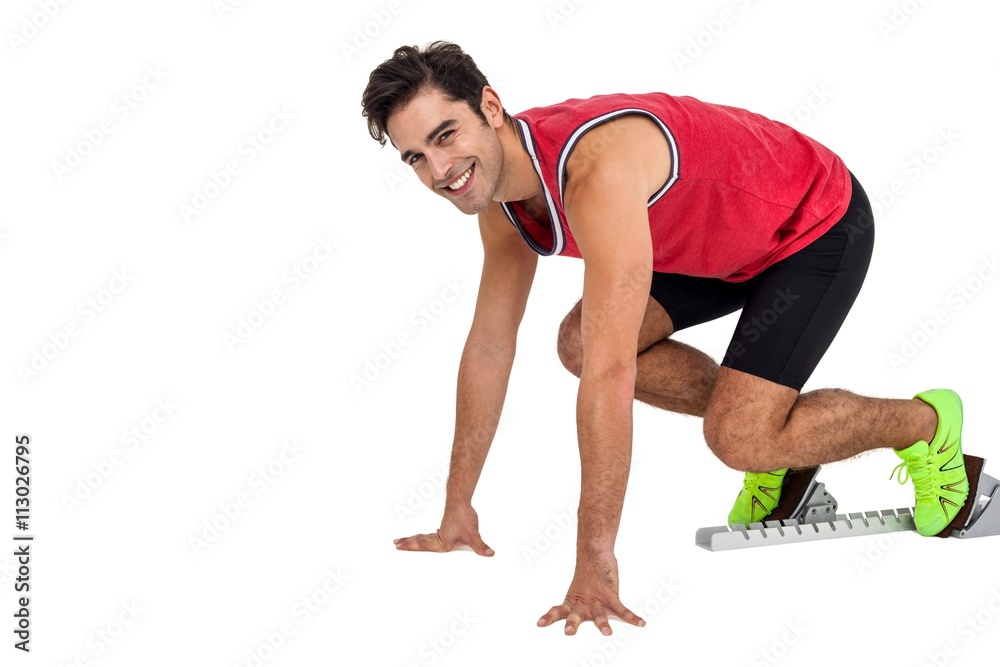 Portrait of male athlete in ready to run position Portrait of male athlete in ready to run position