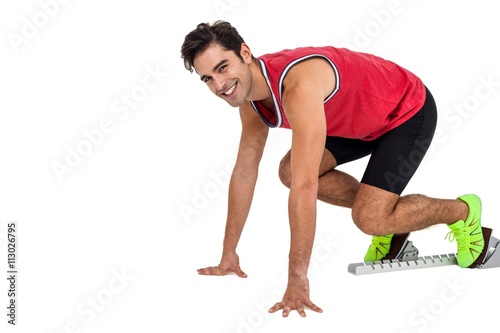 Portrait of male athlete in ready to run position