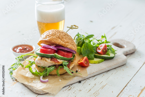 Chicken grill burger on wood background