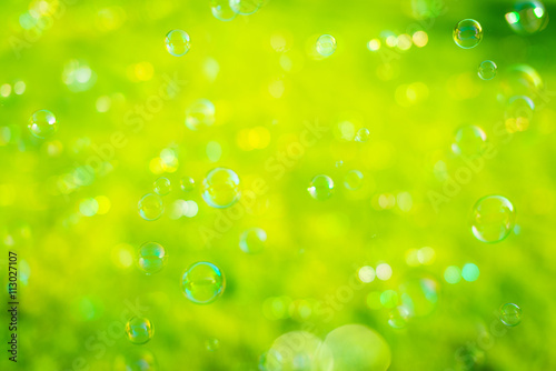 Soap bubbles with green background