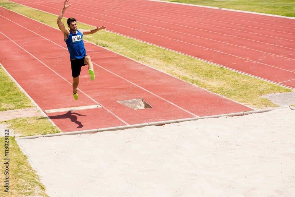 Athlete performing a long jump