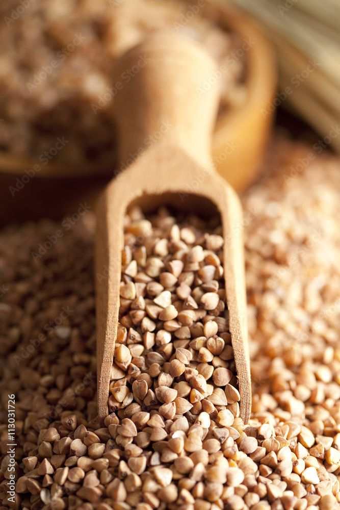 Buckwheat and wooden scoop Buckwheat and wooden scoop