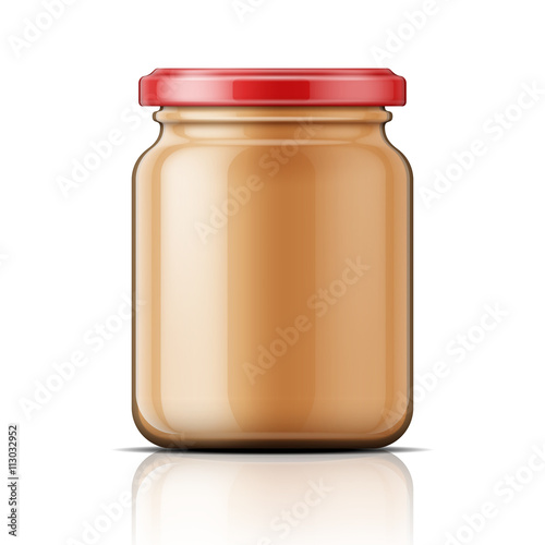 Glass jar with peanut butter.