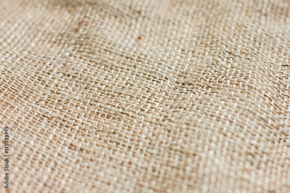 Fototapeta premium texture of coarse cloth with pleats, burlap for background and t