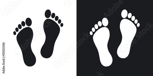 Human footprints icon. Two-tone version on black and white background photo