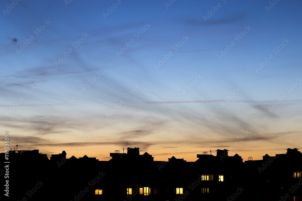 Twilight over roofs of houses