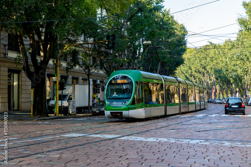 Modern tram green on the streets of Milan. Italy.