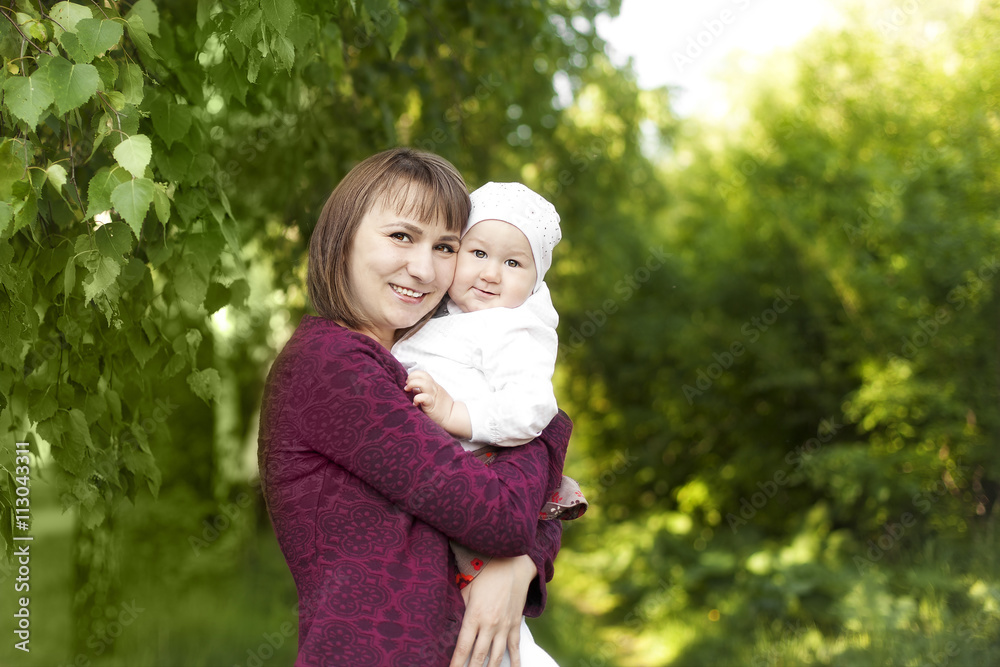 young mother holding a happy child