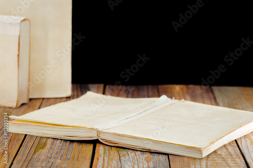 white old books on the background of wooden boards