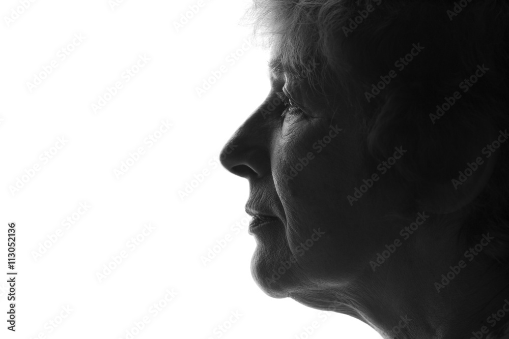 silhouette of an old sad woman