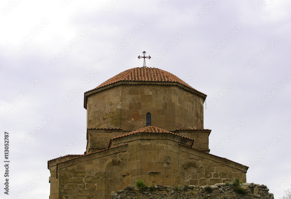 View of the dome of the ancient monastery Jvari against the sky
