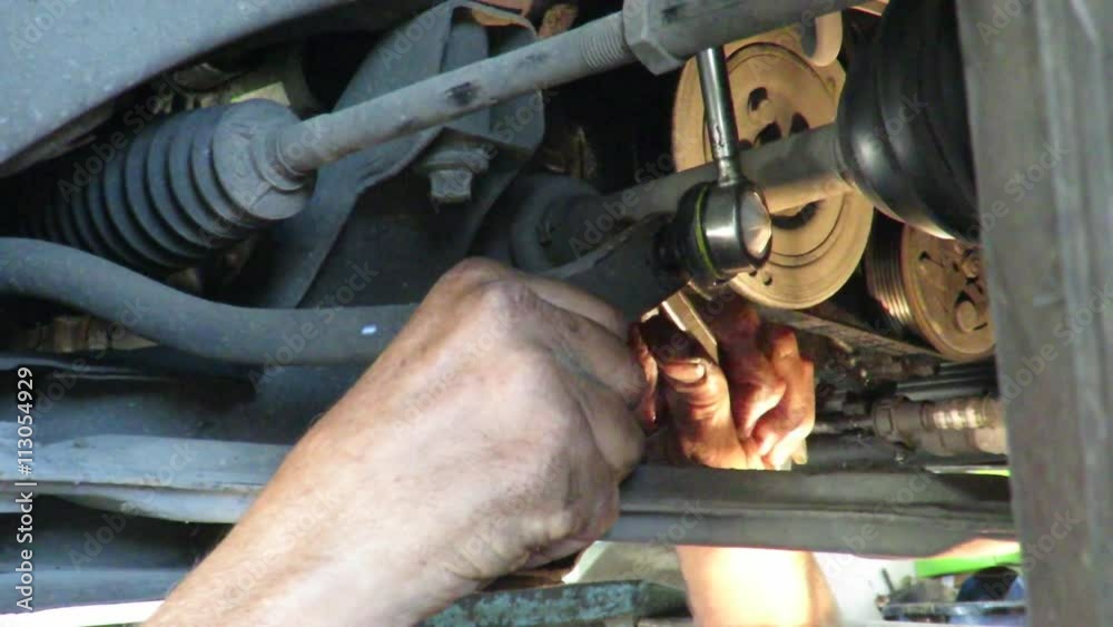 mechanic working under the bridge crane