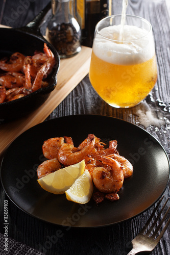 Fried shrimps with light beer glass