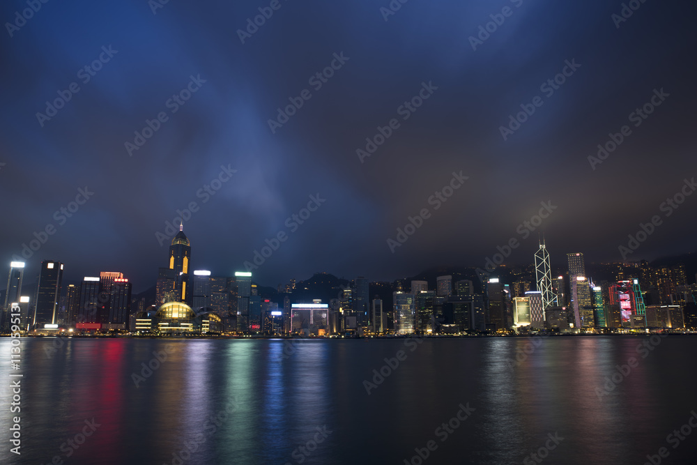 Naklejka premium Night city scape on Hong Kong Harbour.