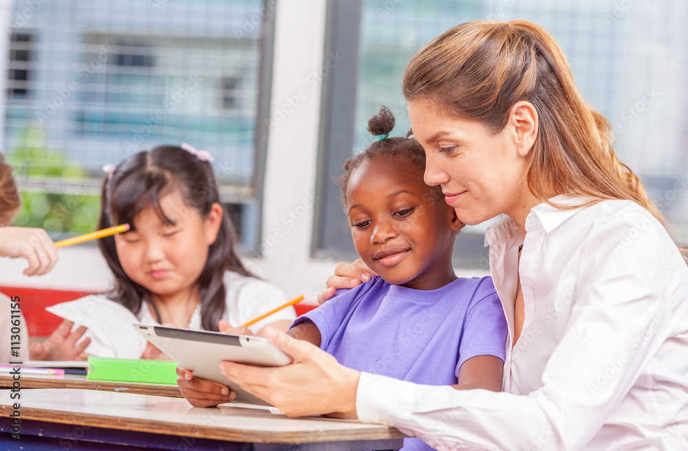 Beautiful teacher with mixed race classroom Beautiful teacher with mixed race classroom