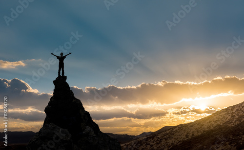 man on the top of a rock