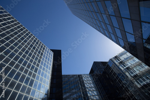 Skyscrapers with glass facade. Modern buildings in Paris business district. Concepts of economics  financial  future.  Copy space for text. Dynamic composition.