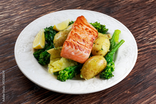 Pan fried Salmon Served with potatoes and tenderstem broccoli.