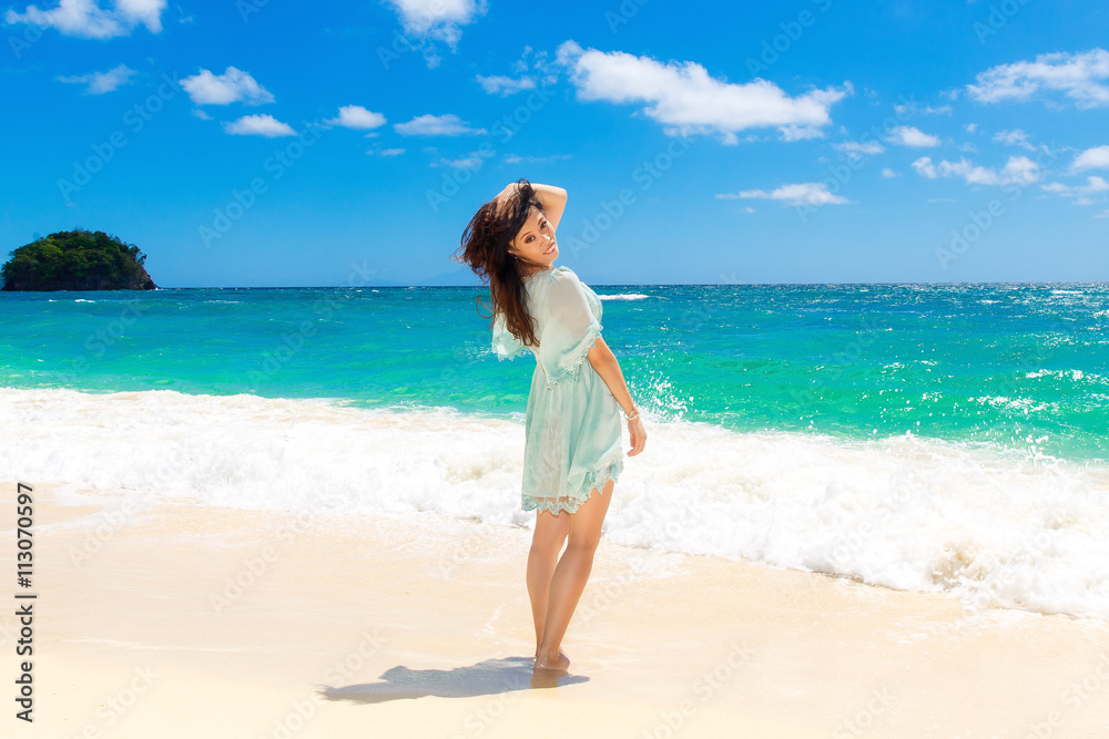 Young beautiful Asian  girl on the tropical beach