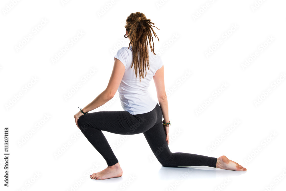 Fototapeta premium Young girl with dreadlocks doing yoga