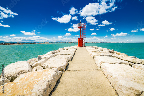 lighthouse on a pier in the Adriatic Sea