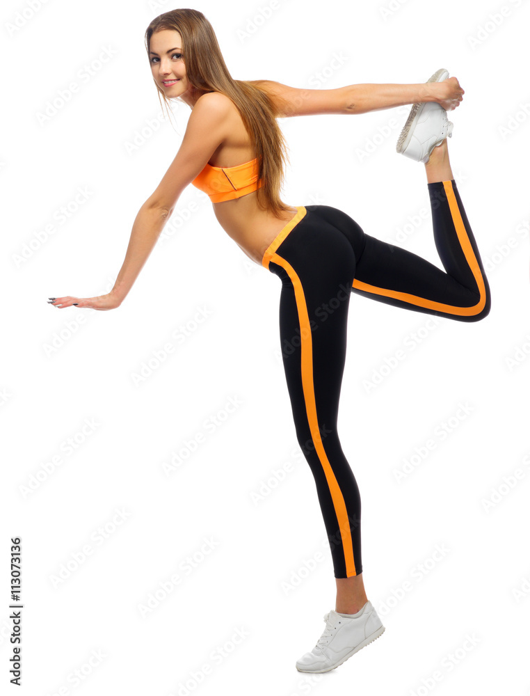 Young sporty girl doing gymnastic exercises