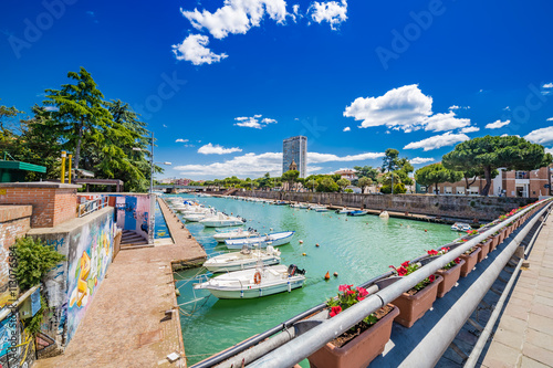 pier with buildings and boats photo