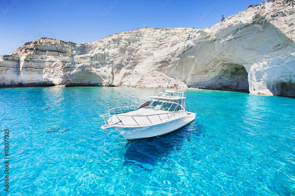 Sailboat in a beautiful bay, Milos island, Greece - obrazy, fototapety, plakaty 