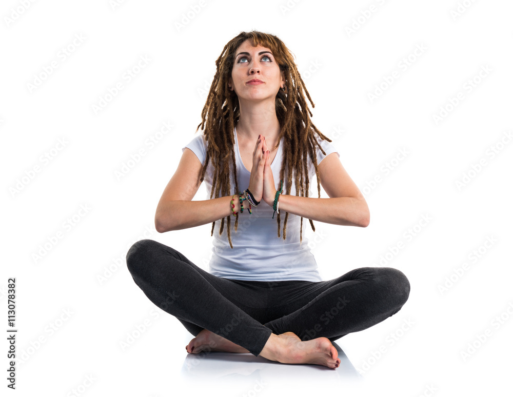 Young girl with dreadlocks doing yoga Young girl with dreadlocks doing yoga