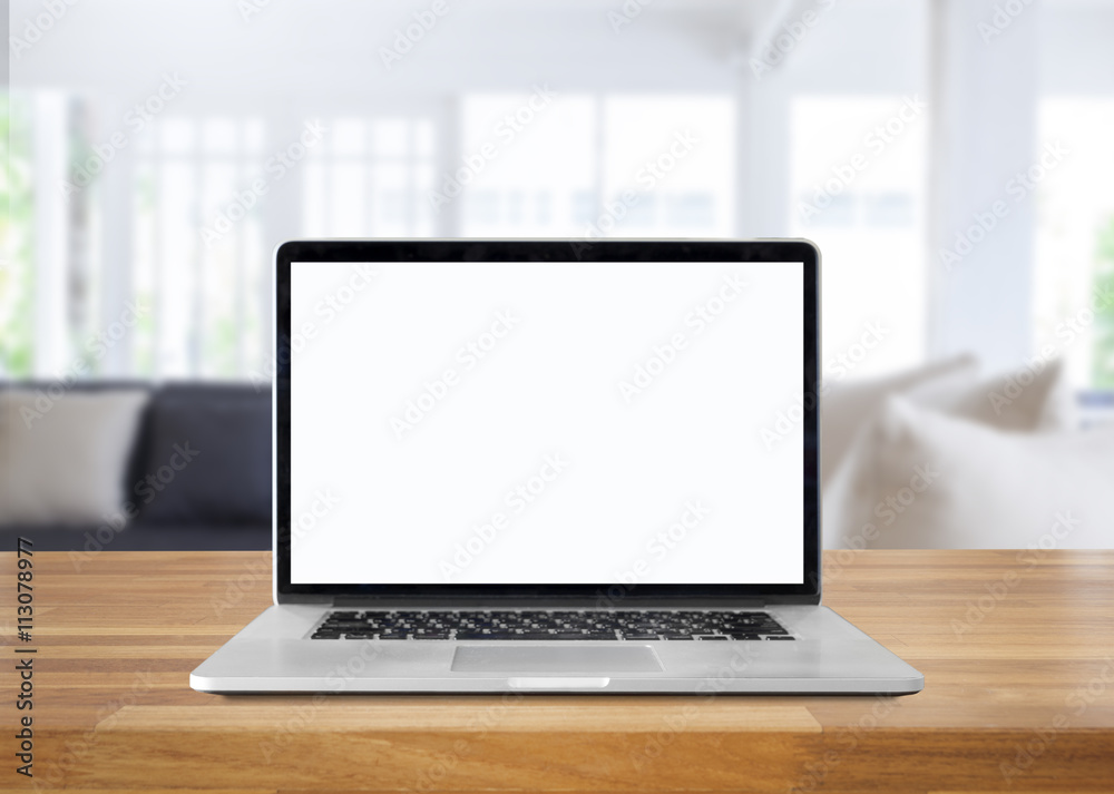 Fototapeta premium Laptop with blank screen on table. interior background