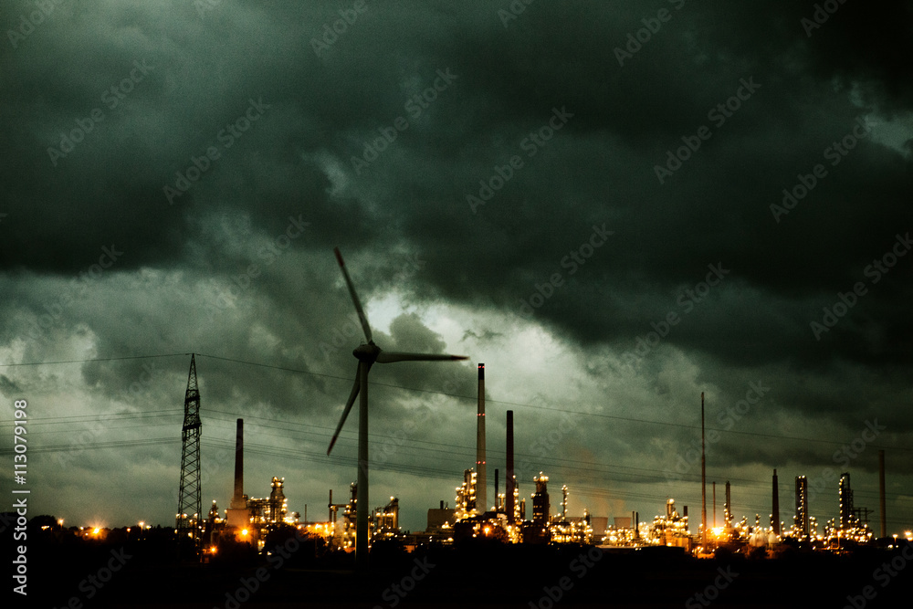 Night shot of wind turbine and power station in Schleswig Holstein, Germany Night shot of wind turbine and power station in Schleswig Holstein, Germany