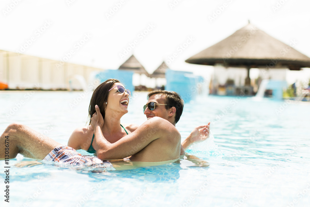 Young couple in the pool