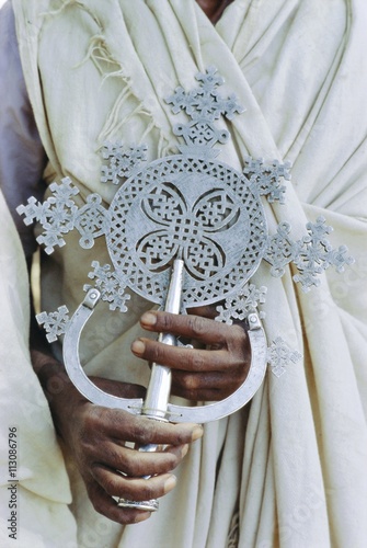 Close up of priest holding cross, Church of Narga Selassie, Lake Tana, Gondar, Ethiopia photo