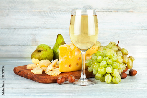 Wineglass white wine with fruits nut