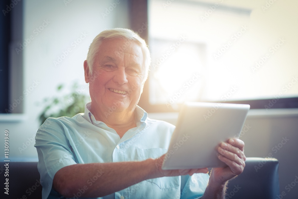 Senior man using digital tablet Senior man using digital tablet