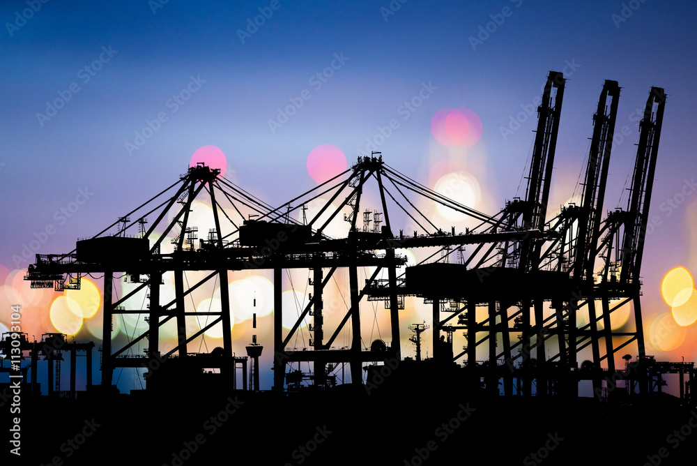 Logistic Import Export background, Bokeh of Port cranes working at night in sea port, Shipping, Logistics, Transportation Systems, Industrial Container Cargo freight ship. Logistic Import Export background, Bokeh of Port cranes working at night in sea port, Shipping, Logistics, Transportation Systems, Industrial Container Cargo freight ship.