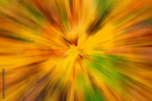 blurry abstract yellow green background texture with radial streaks