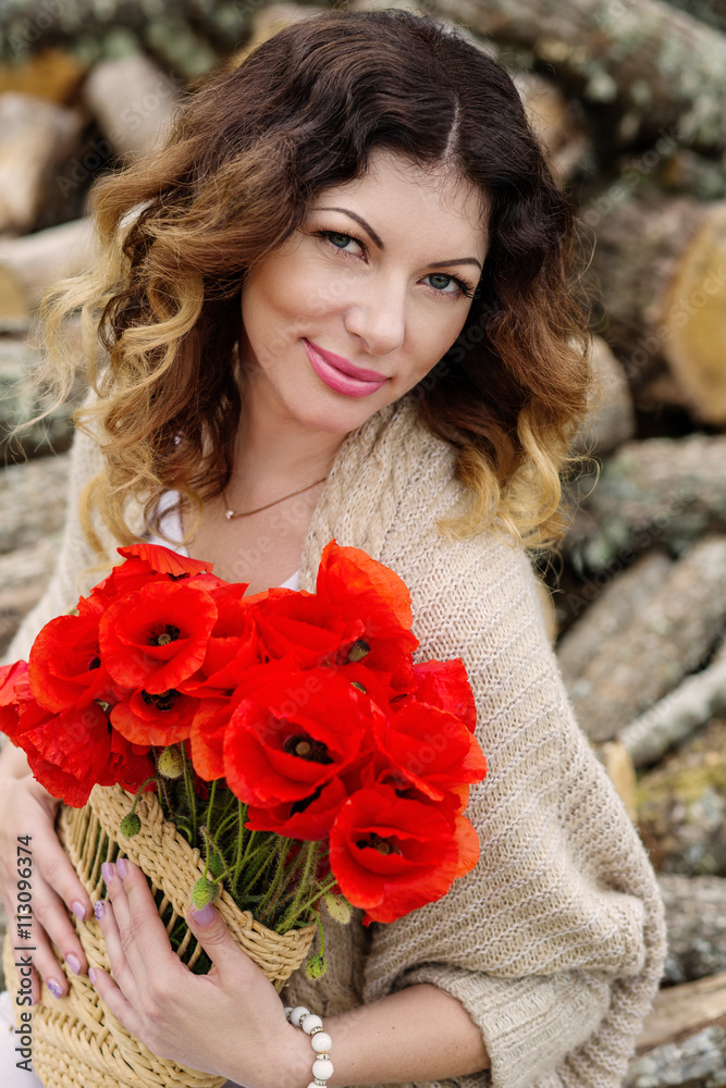 beautiful young woman with a bouquet of poppies beautiful young woman with a bouquet of poppies