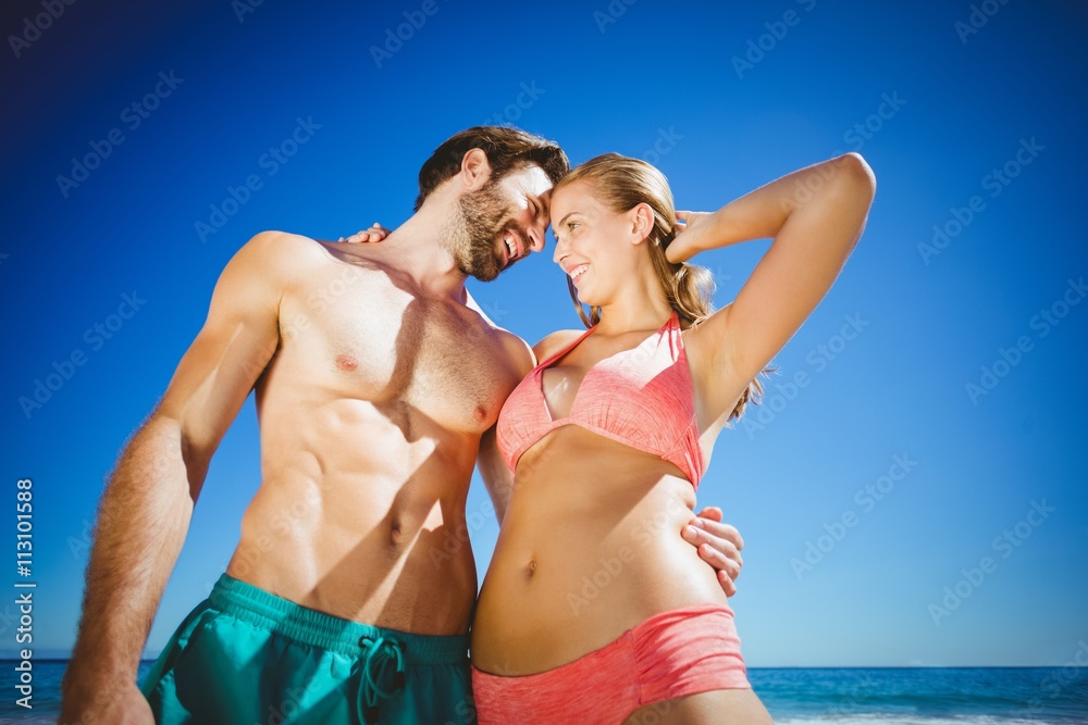 Young couple embracing each other on beach