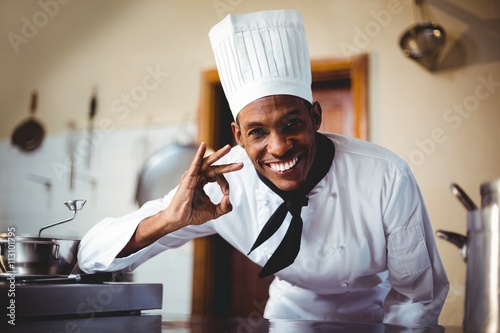 Portrait of happy chef making ok sign