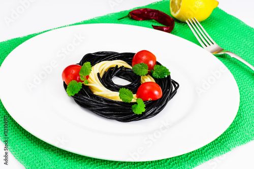 Black Spaghetti with Cuttlefish Ink, Tomato and Basil. Mediterra photo