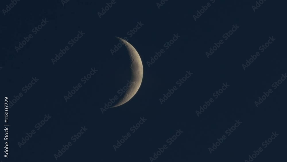 Time lapse of an half moon as it rises in the black night sky. Time lapse of an half moon as it rises in the black night sky.