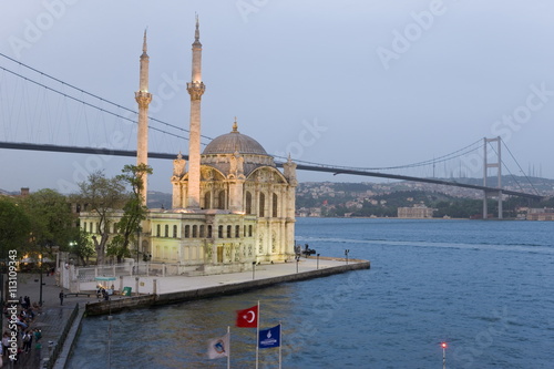 Elevated view over the Bosphorous Bridge and Ortakoy Camii Mosque (Buyuk Mecidiye Camii) in the trendy Ortakoy district, Istanbul, Turkey photo