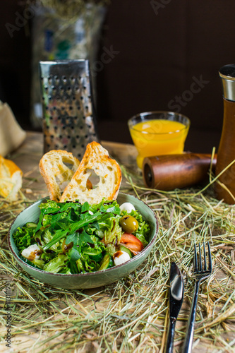 Beautiful fresh salad with rocket, croutons and Parmesan cheese